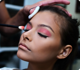 Makeup artist doing a lady's eyelid